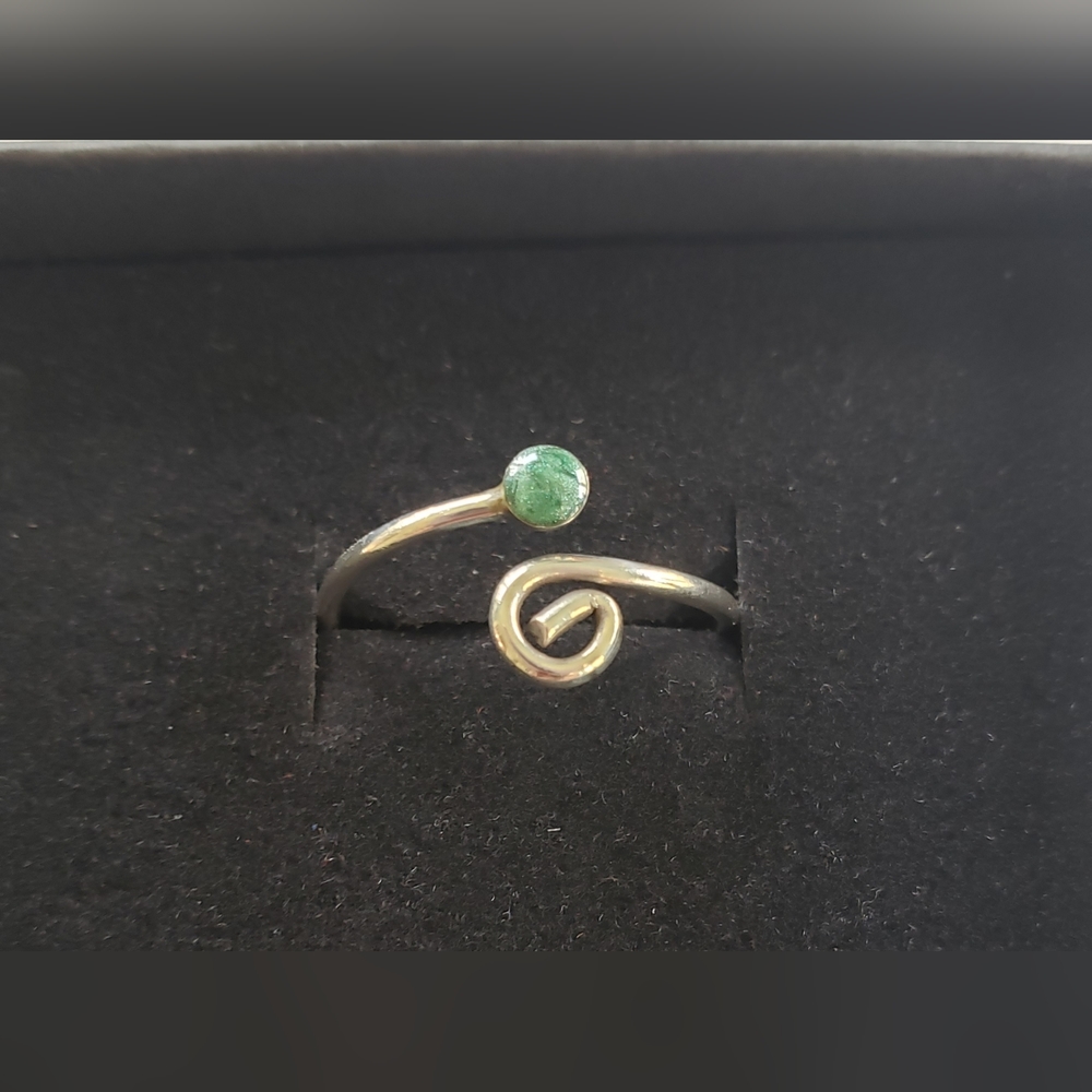 Dainty metal ring with green accent